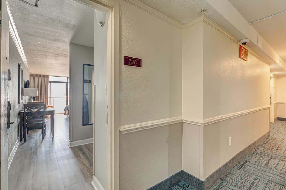 Sleek and Functional: Our room combines the warmth of a beach retreat with the convenience of a kitchenette, ideal for quick bites before the beach.