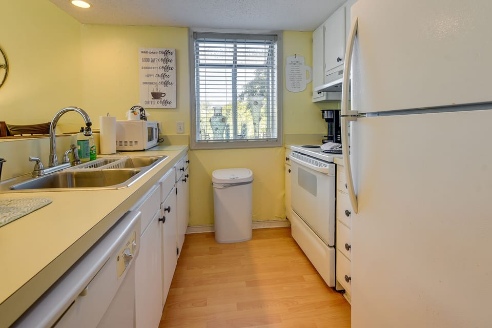 Kitchen | Community Perks | Central Air Conditioning | Walk to Beach