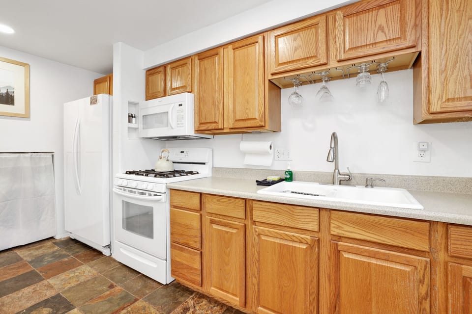 Cook comfortably in this bright kitchen with generous counter space and a functional layout perfect for preparing meals, snacks, and warm drinks year-round.
