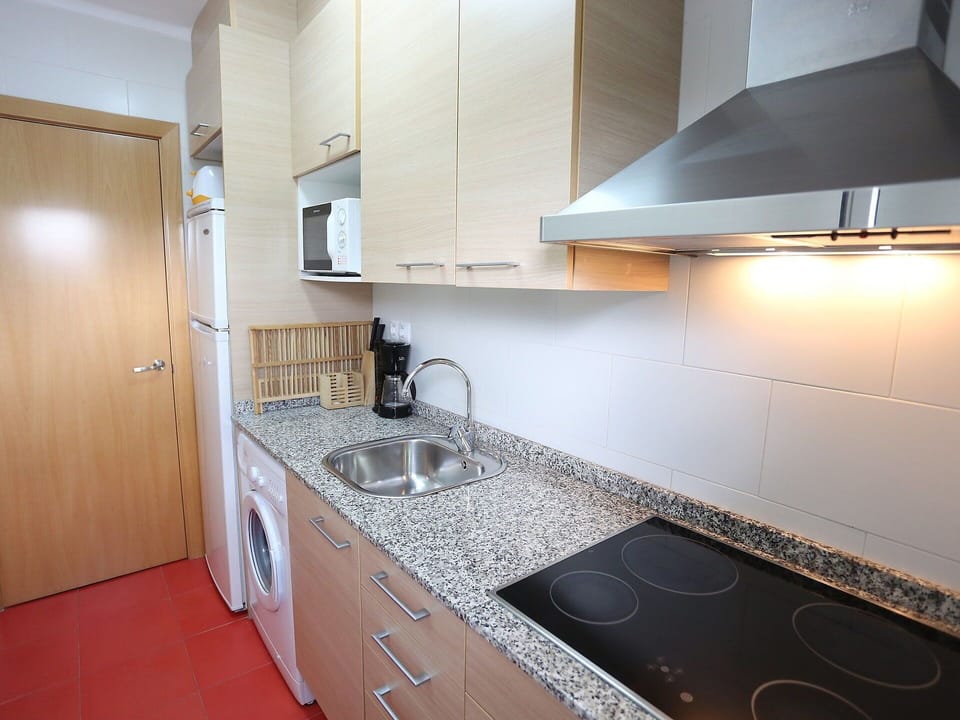 Countertop, Room, Property, Cabinetry, Kitchen, Furniture, Kitchen Stove, Sink, Interior Design, Tile
