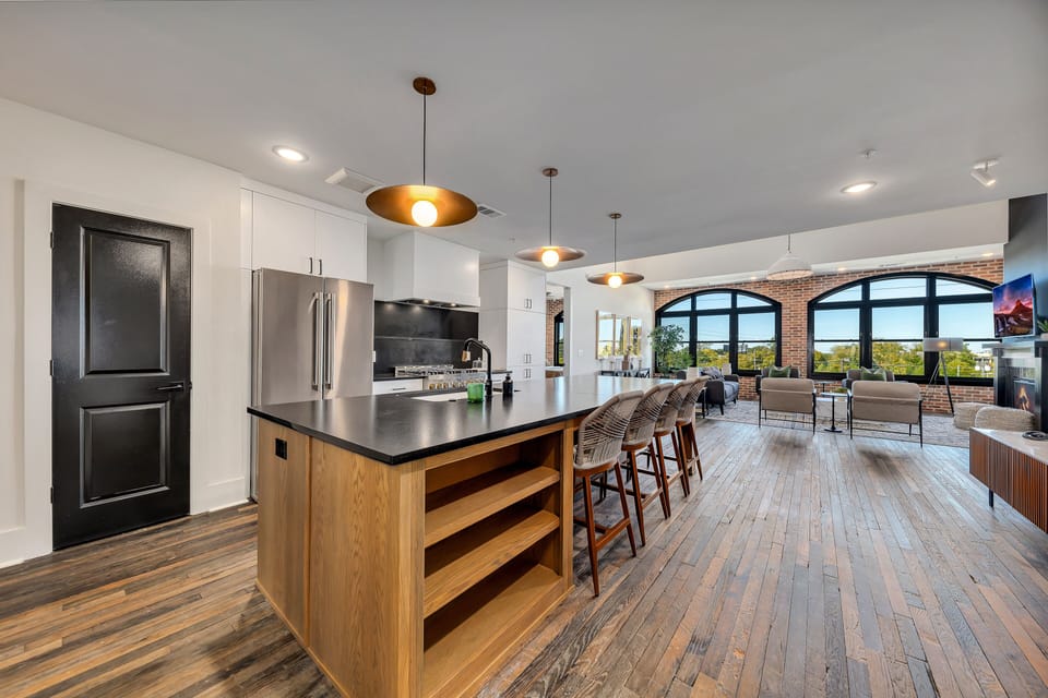 Spacious kitchen w/ large island, bar seating & sleek finishes for easy entertaining