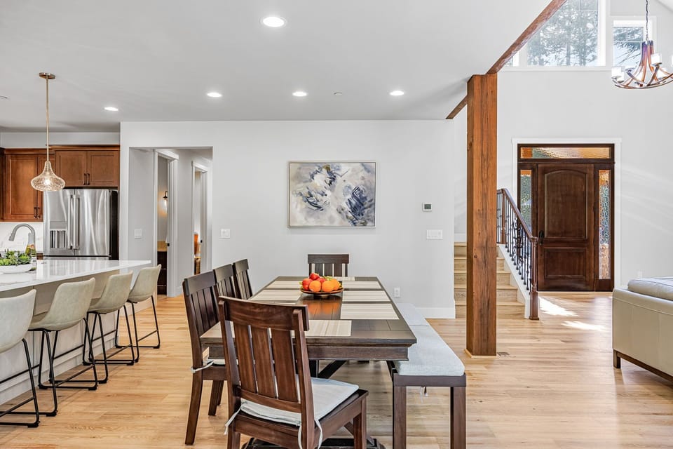 Rustic-modern dining — bench seating, island bar and bright open plan