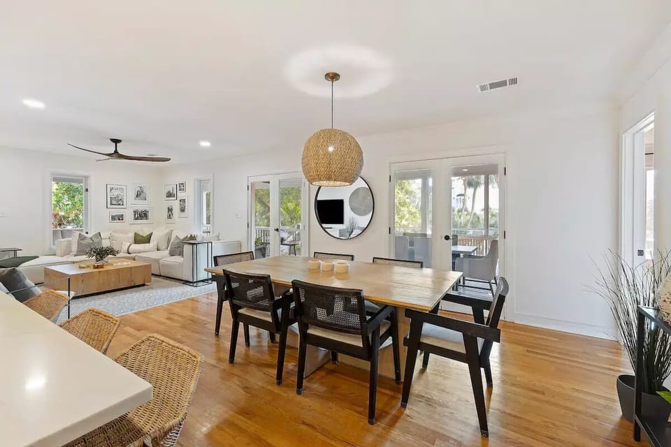 Indoor dining at the table plus more seating at the kitchen counter.