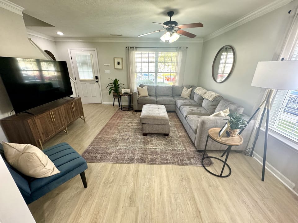 🛋️ Welcome & Entertain
The living room greets you as you walk in, connected to the dining area and kitchen — perfect for relaxing, chatting, or enjoying your favorite shows and games with fast streaming while others cook or dine.