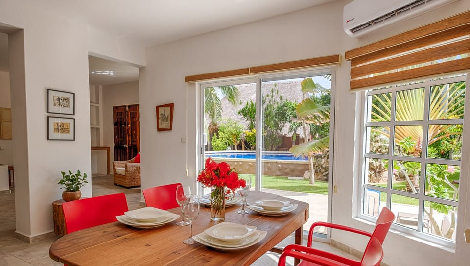 Dining Area with Garden and Pool Views