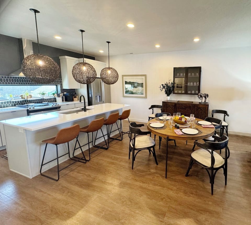 Seating for 10 includes dining room table and large kitchen island