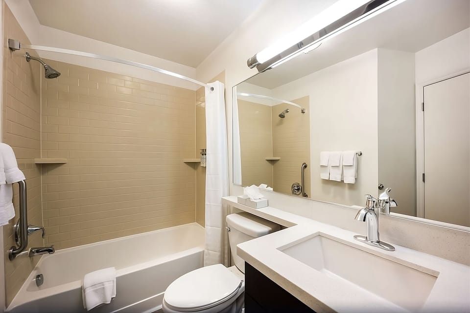Refresh with a spotless tub-shower and roomy vanity space.