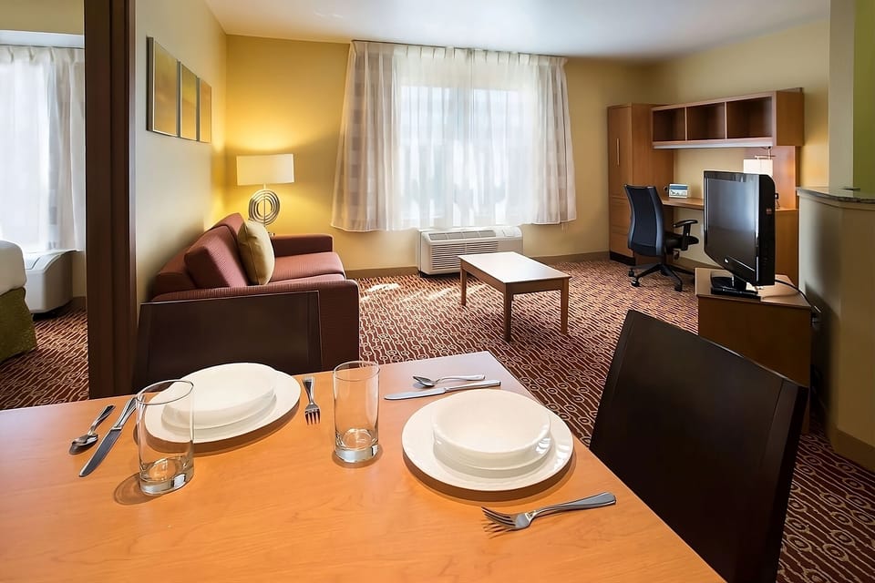 Gather for relaxed dinners in your comfortable in-room dining area.