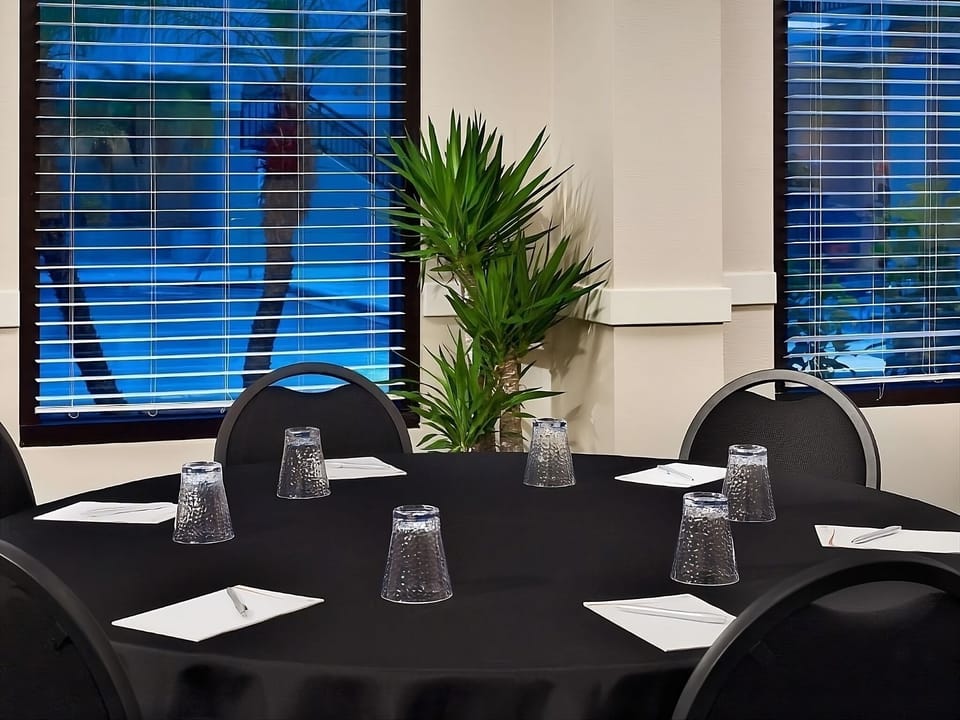 Host productive meetings around a spacious table with natural light.