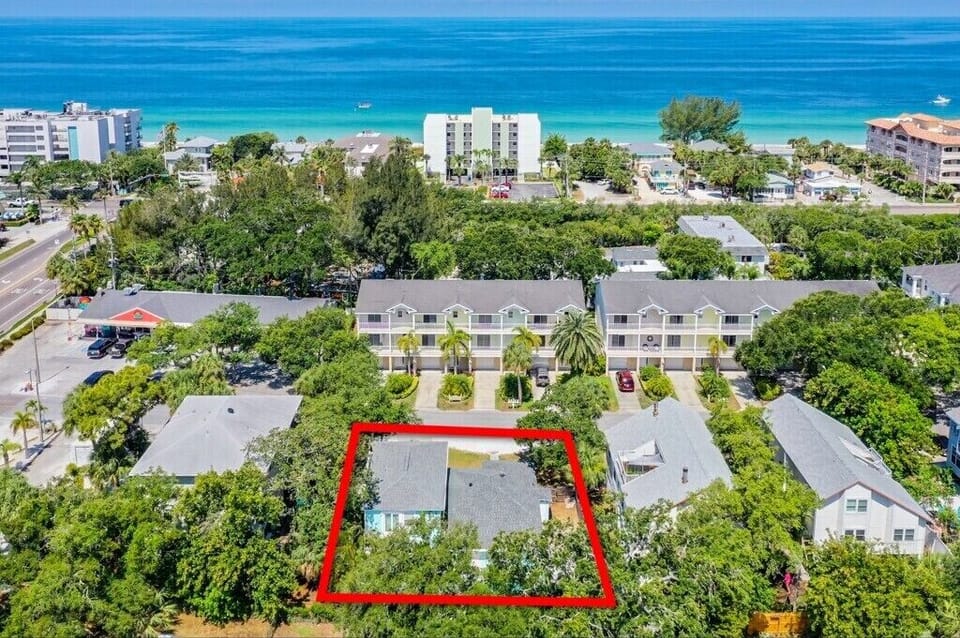 Enjoy the peace and quiet of this oak-lined street just a quick walk to sandy beaches, shops, restaurants, and pubs. 