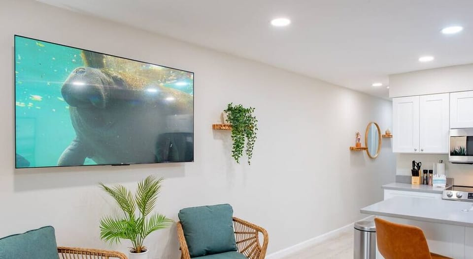 Immerse yourself in entertainment as you sit back and enjoy this massive flat-screen smart TV
