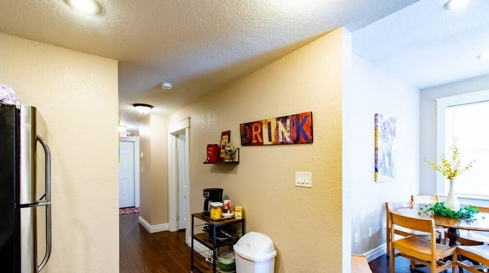 The hallway allows for convenient entry and leads directly into the kitchen and the living room.