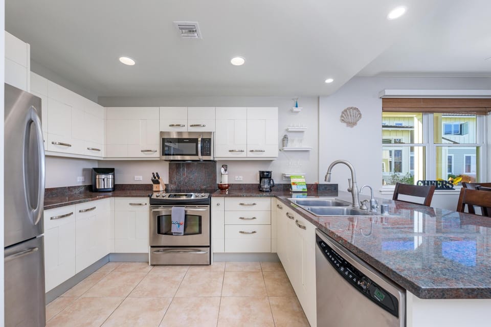 Full kitchen with granite countertops and stainless steel appliances