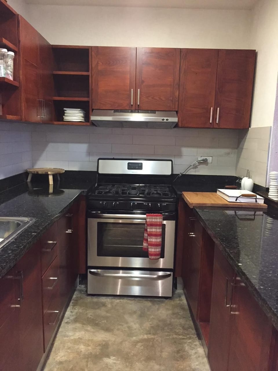Open kitchen with pantry and stools.