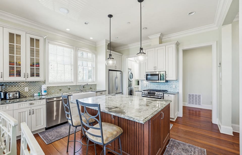 Kitchen with Island Bar,  Dining Area and Full Pantry with Washer and Dryer