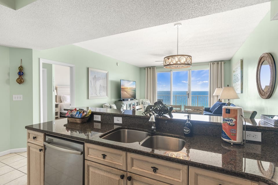 Kitchen has GULF VIEWS, granite countertops, stainless appliances - fully stocked with more than the basics (coffee/tea bar, oils/spices, Tupperware, plenty of pots/pans/cookware)