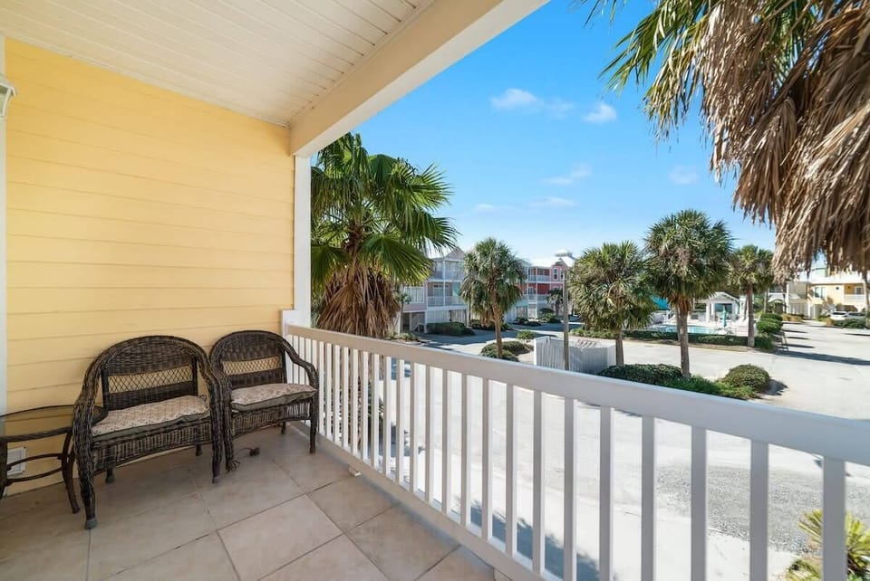 Balcony off living area facing pool.