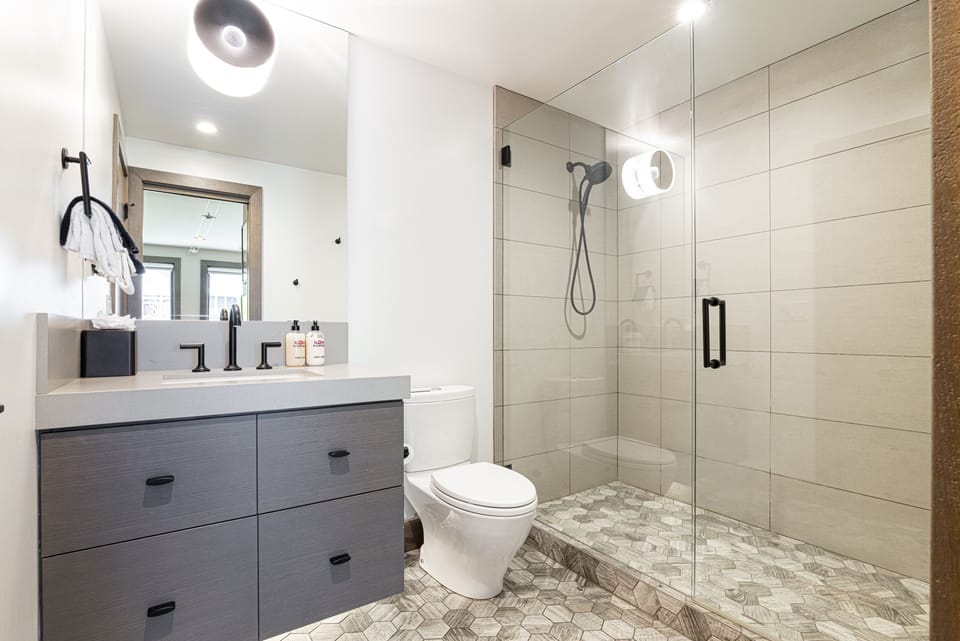 Unit F - Master En Suite 3 with a tile/glass  shower