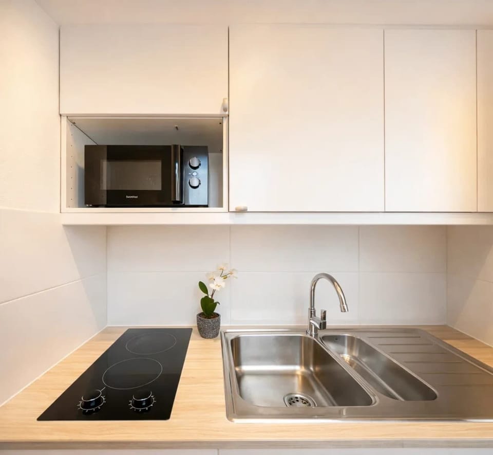 This kitchen will provide you all the facilities you need to feel at home, washer also included