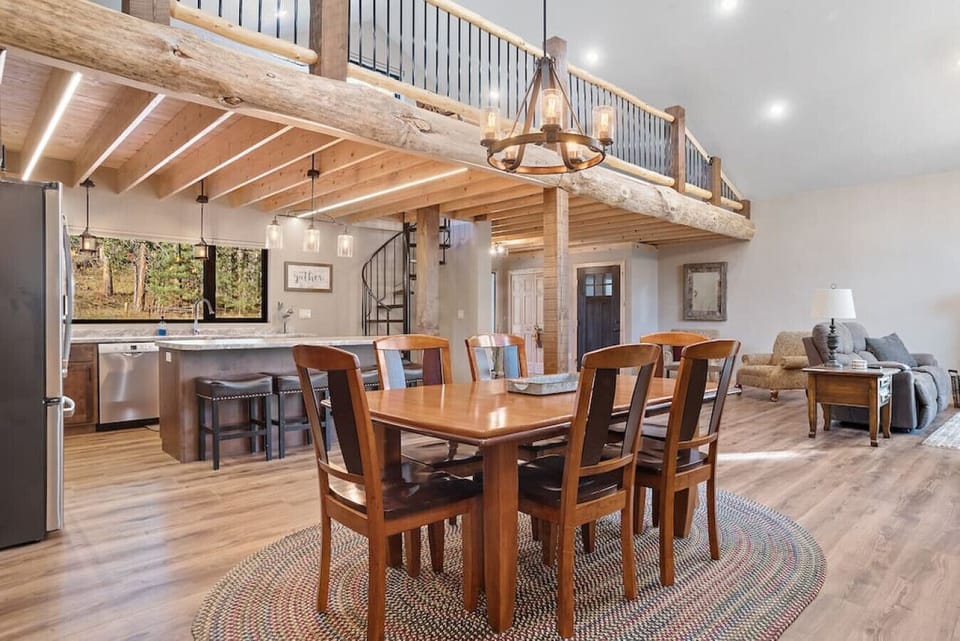 A spacious dining area with an elegant table and six comfortable chairs.