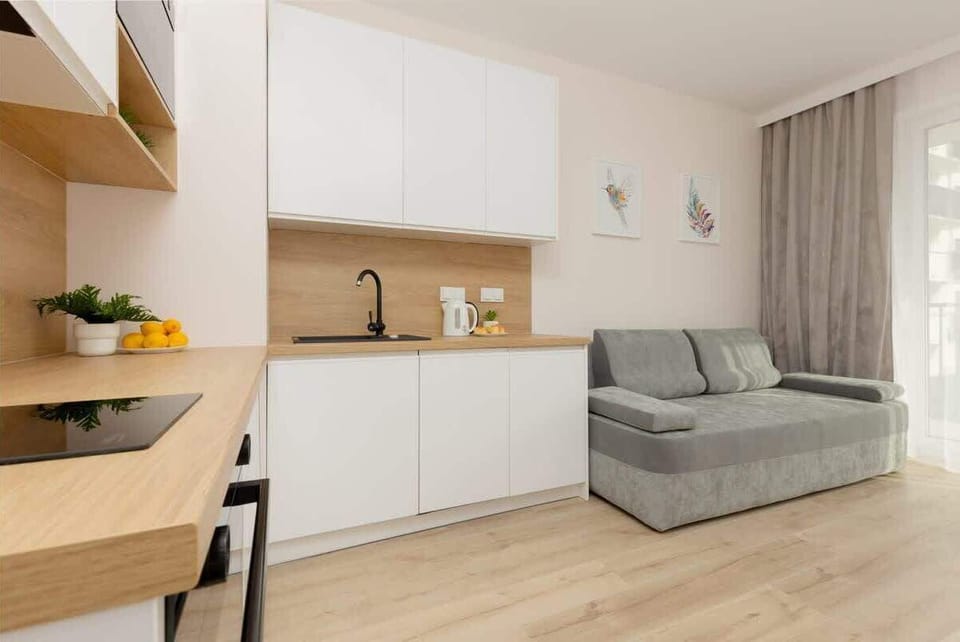 Another perspective of the kitchen and living room, showcasing the cohesive modern design.
