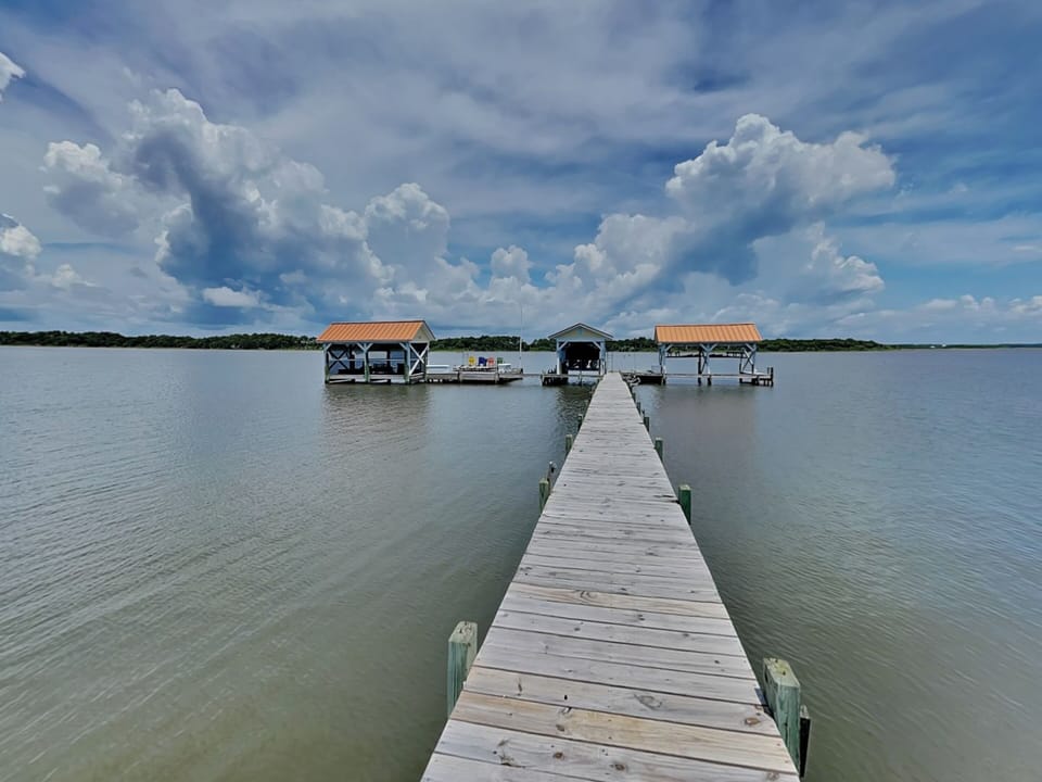 Step Out to Your Private Dock with Boat Slip + Screened-In Area