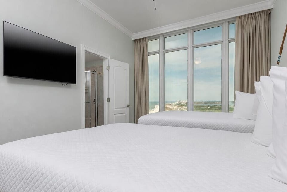 Stream your favorite shows to unwind after a day at the beach and relax with a coastline view from your queen guest room
