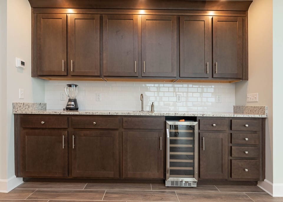 Grab a chilled bottle from the wine cooler, blend a smoothie, or create your favorite cocktail at the wet bar