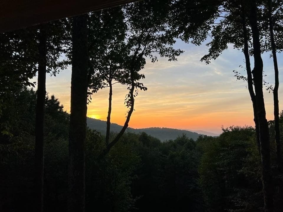 Capturing the breathtaking beauty of a stunning sunset view from the comfort of home.
