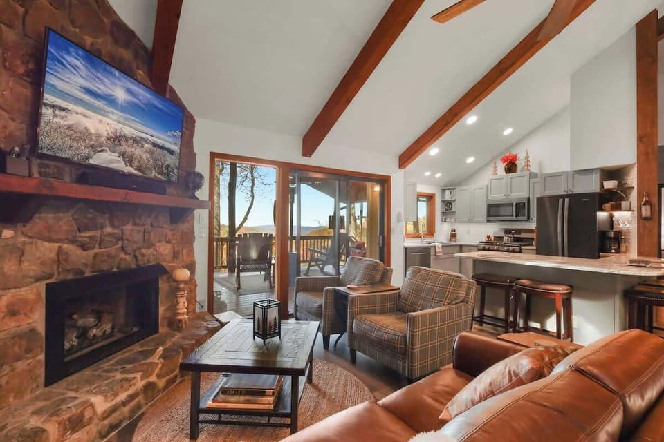 Welcome to our Homey Retreat, where you can instantly feel at home surrounded by a cozy couch, two chairs, a coffee table, a gas fireplace, and a smart TV with streaming.