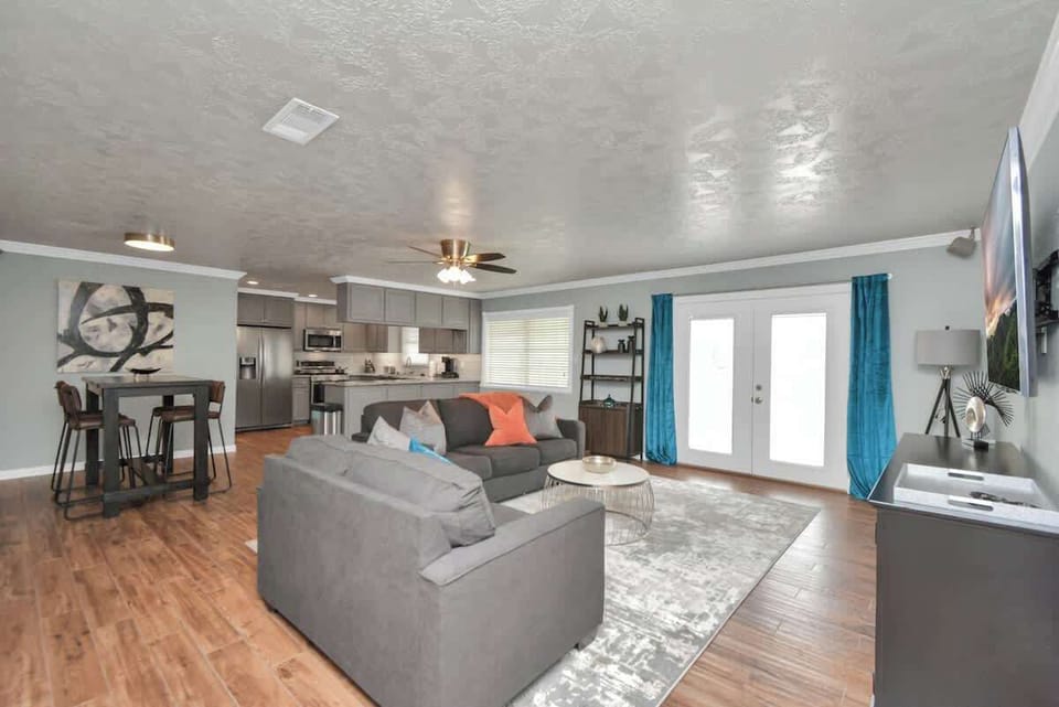 Enjoy the open floor plan of the living room that seamlessly flows into the kitchen & dining area, making it the perfect space for entertaining friends & family. Gather together in a warm, inviting atmosphere where memories are made!