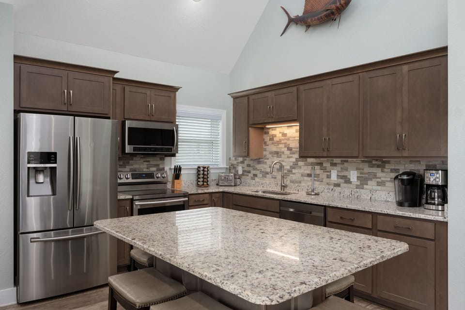 NH387B: Ocracoke Cottage | Kitchen and Dining Area- Island Seating for 6