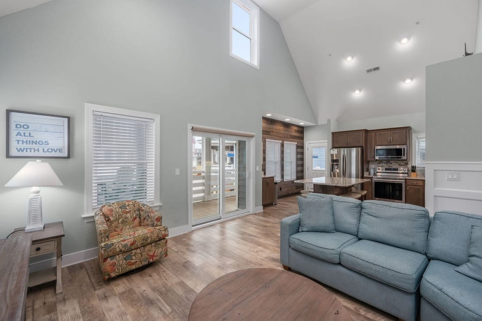 NH387C: Oak Island Cottage | Living Area, Deck Access