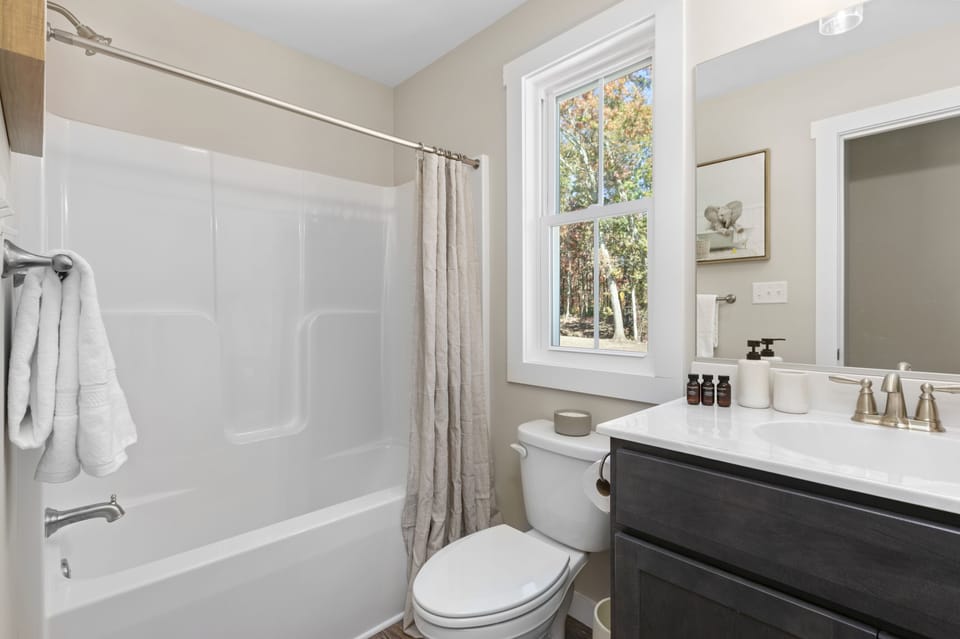 Bathroom 2 offers a shower/tub combo.