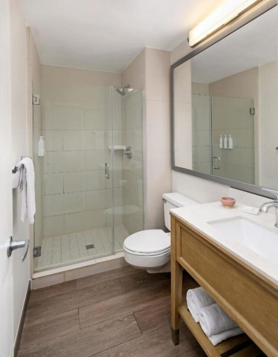 Refresh easily in a spotless bath with glass walk-in shower.
