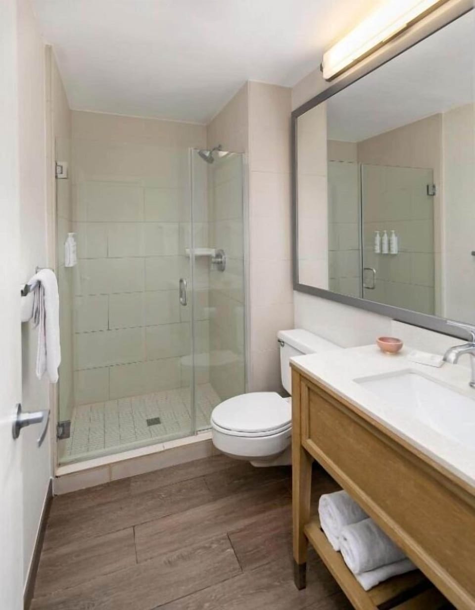 Refresh easily in a spotless bath with glass walk-in shower.