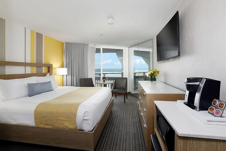 Wake up to ocean breezes with balcony views and coffee.