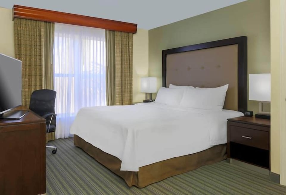 Sleep deeply in a quiet, spacious room with warm lighting.