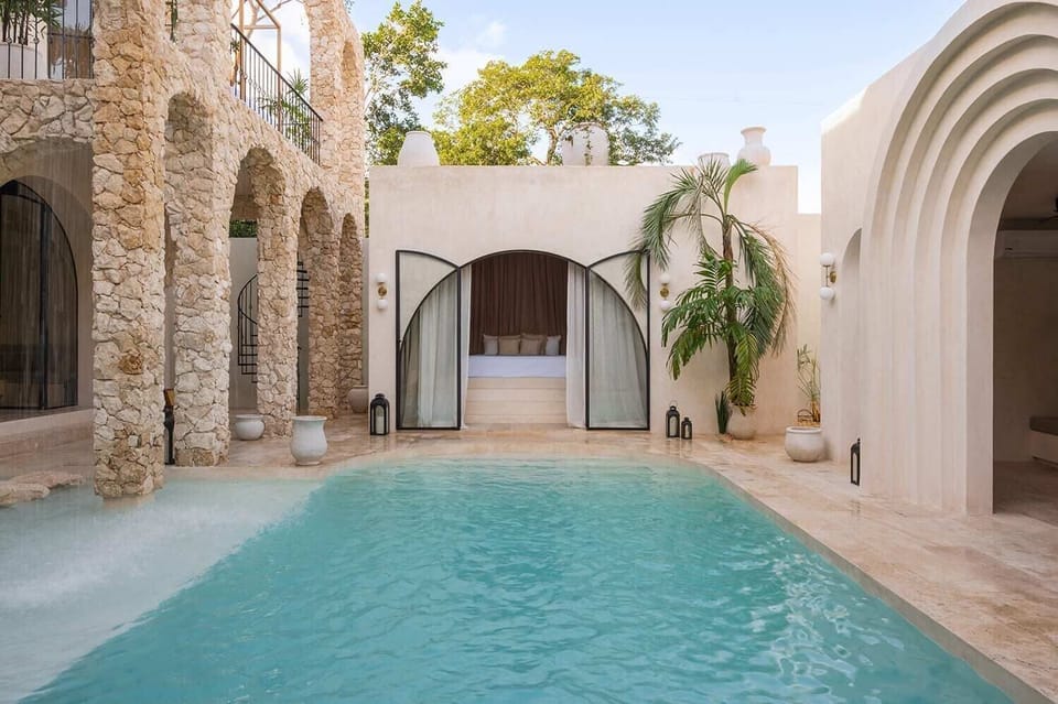 Wake up to the serene sounds of water and bask in the sun's warmth as you step out of your room.