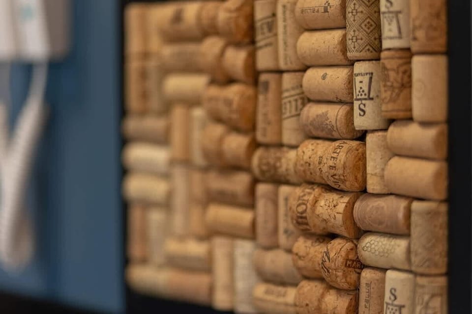 A close-up of a decorative detail: a collection of corks arranged artistically.
