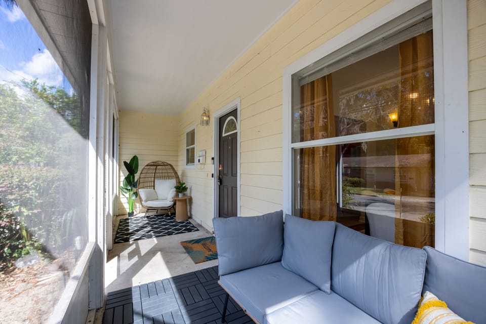 Front porch with cozy longe and egg chair at the far end