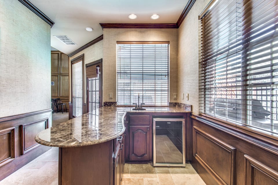 Designed with entertaining in mind, with this bar area near the game room.