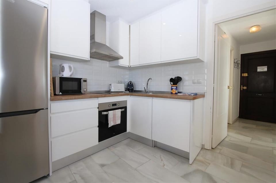 Modern open kitchen is very well fitted with quality appliances