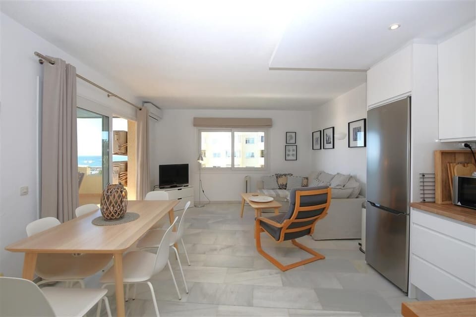 Full view of the lounge area and dining area from the open kitchen