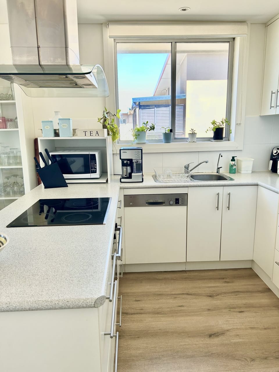 Ample kitchen with appliances (including a Sunbeam Coffee machine).